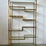Old shelf in golden metal brass geometric library design 80s vintage