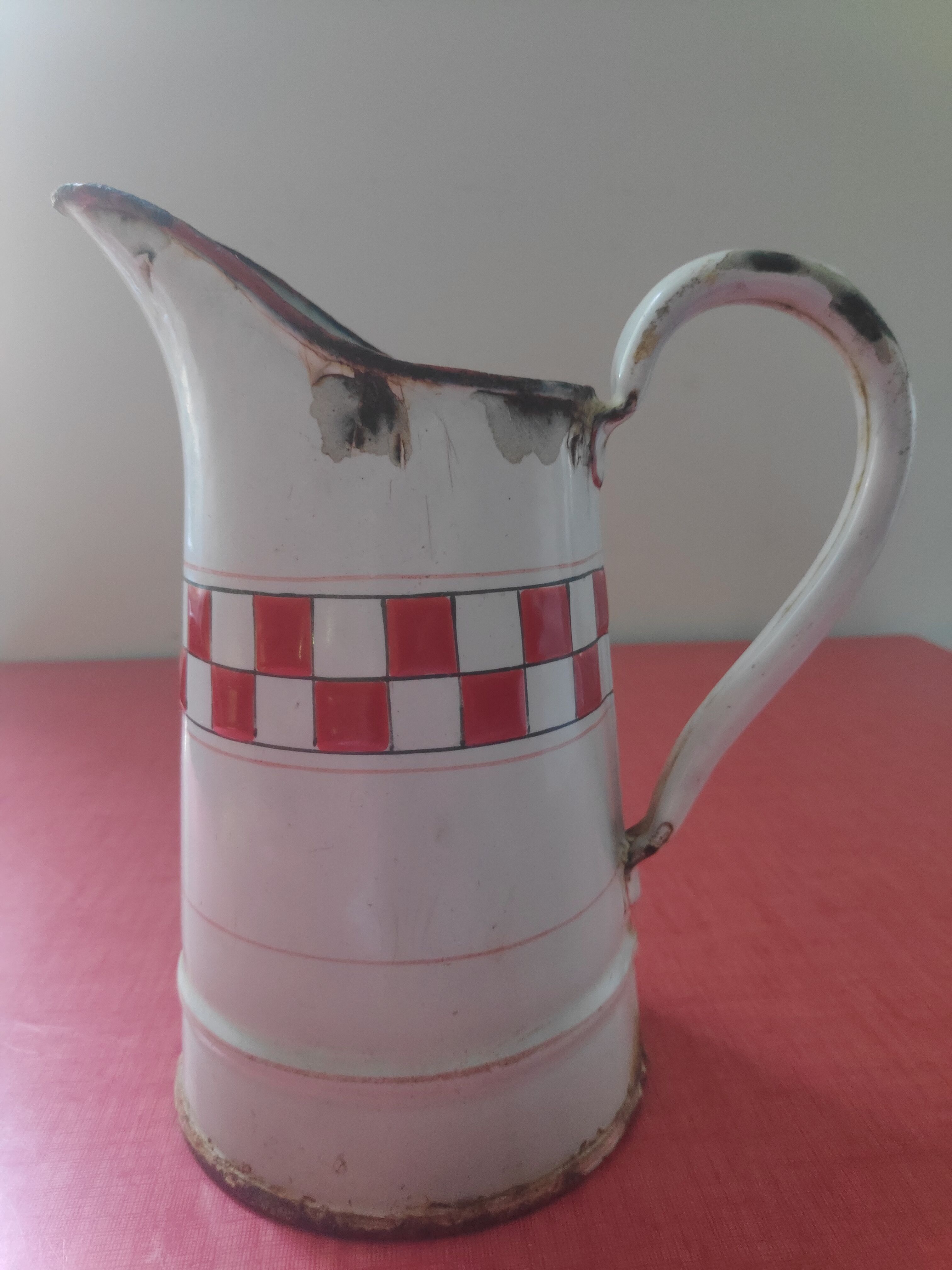 Enamelled sheet metal pitcher Lustucru décor