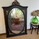 Large old trumeau mirror in black and gilded wood Napoleon style