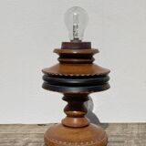 Foot of turned wooden lamp and carved