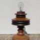 Foot of turned wooden lamp and carved