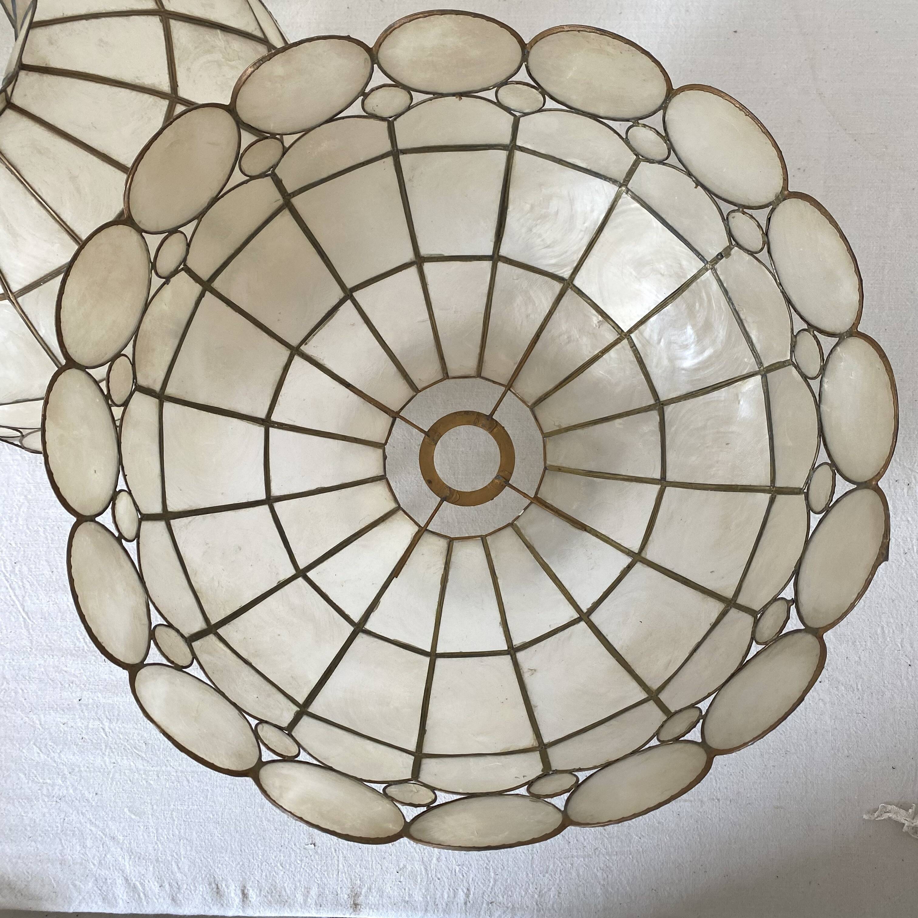 Pair of mother-of-pearl and brass pendants