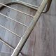 Tubular metal chair covered with gilding