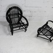 Pair of black lacquered rattan armchairs. France, cira 1960.