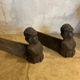 Pair of cast iron andirons with face