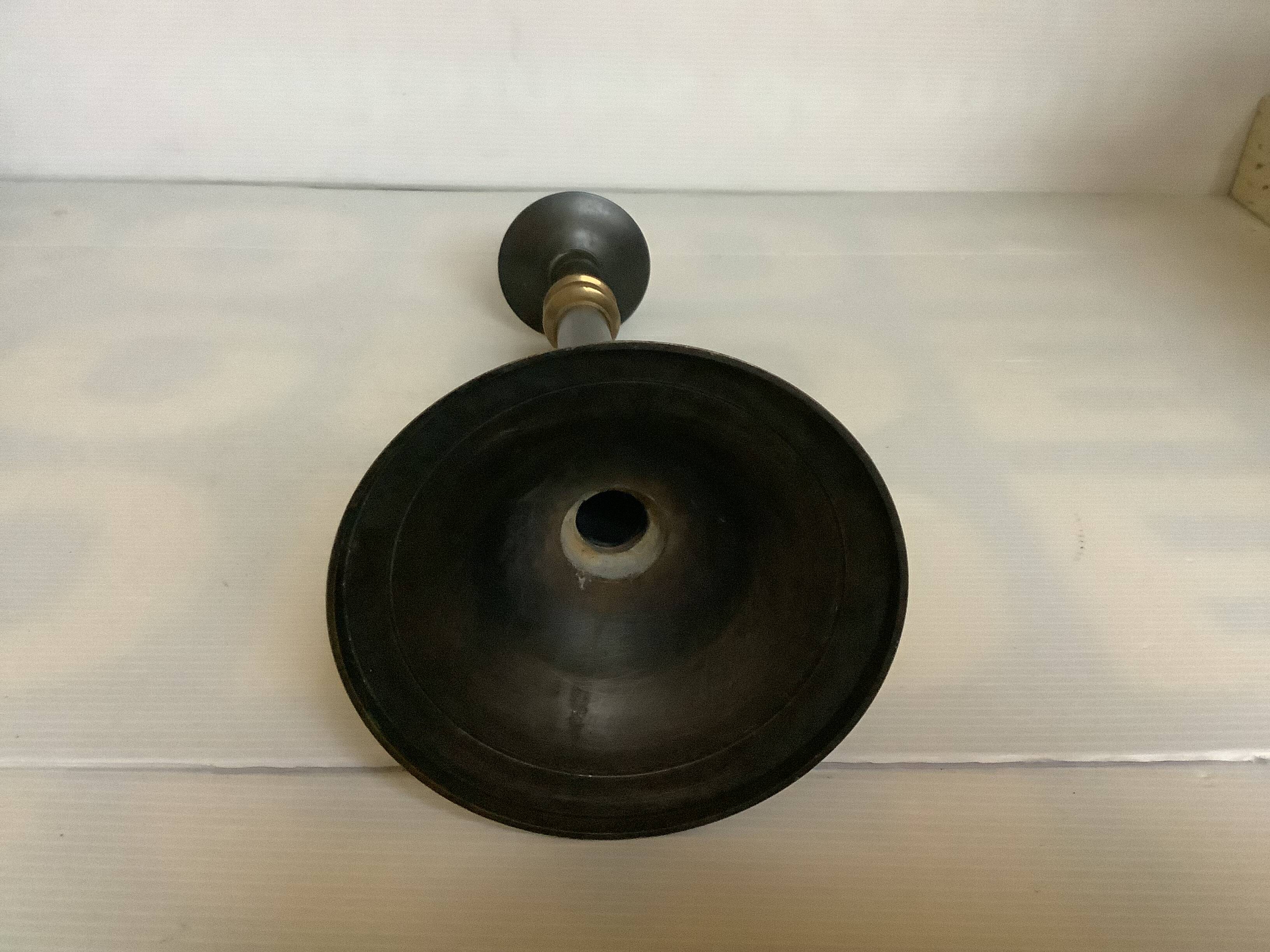 Large candlestick made of sheet metal and brass
