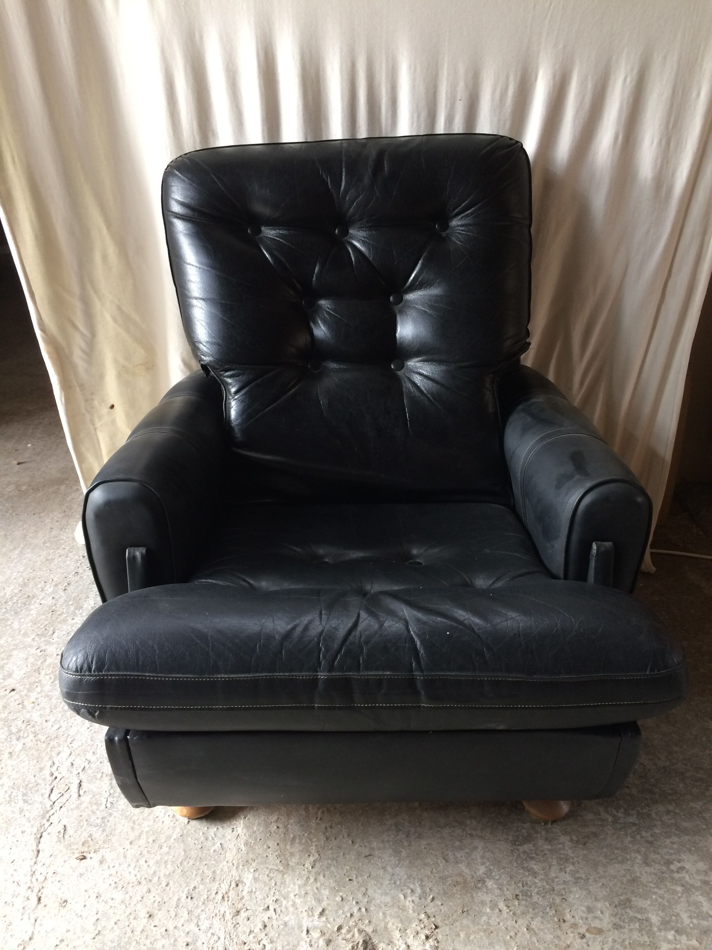 Former black leather chair