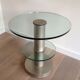 Brushed metal pedestal table and glass slabs