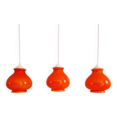 Trio of vintage orange opaline pendant lights, 1960-70
