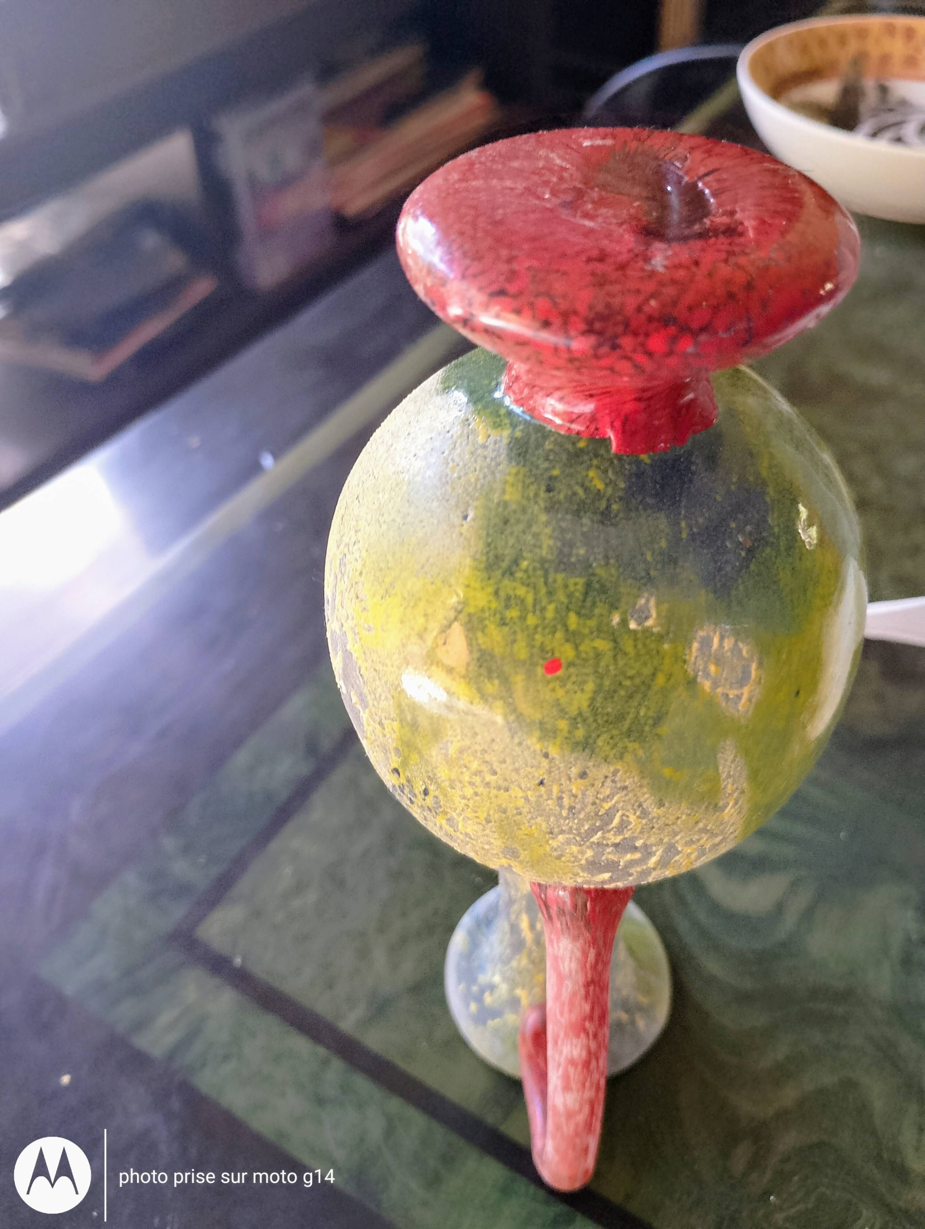 Small vintage glass vase with a red handle – Speckled green and yellow decoration
