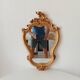 Vintage rococo mirror in gilded resin