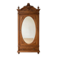 Antique solid wood wardrobe with an oval mirror.