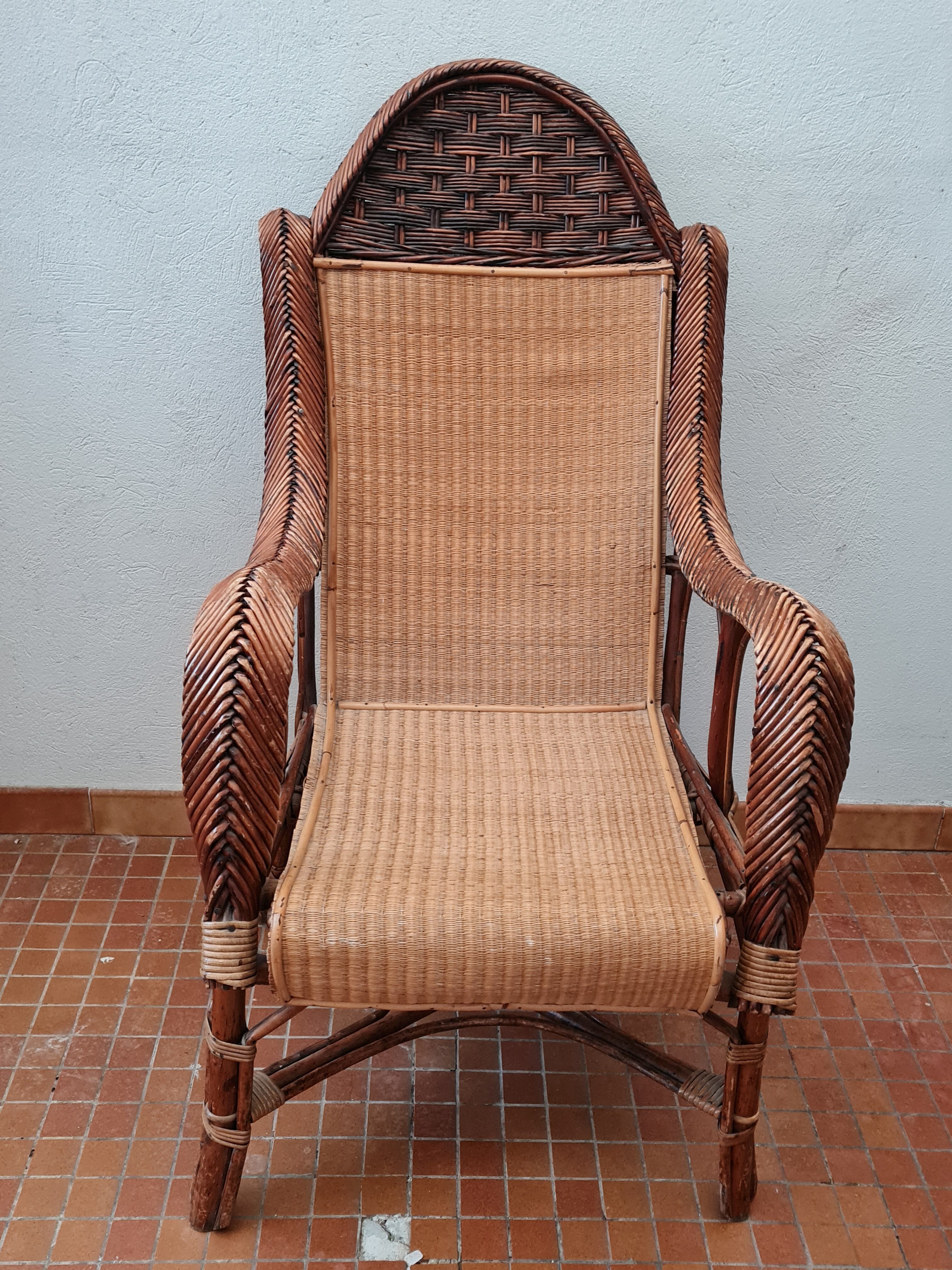 Old rattan armchair circa 1900-1930