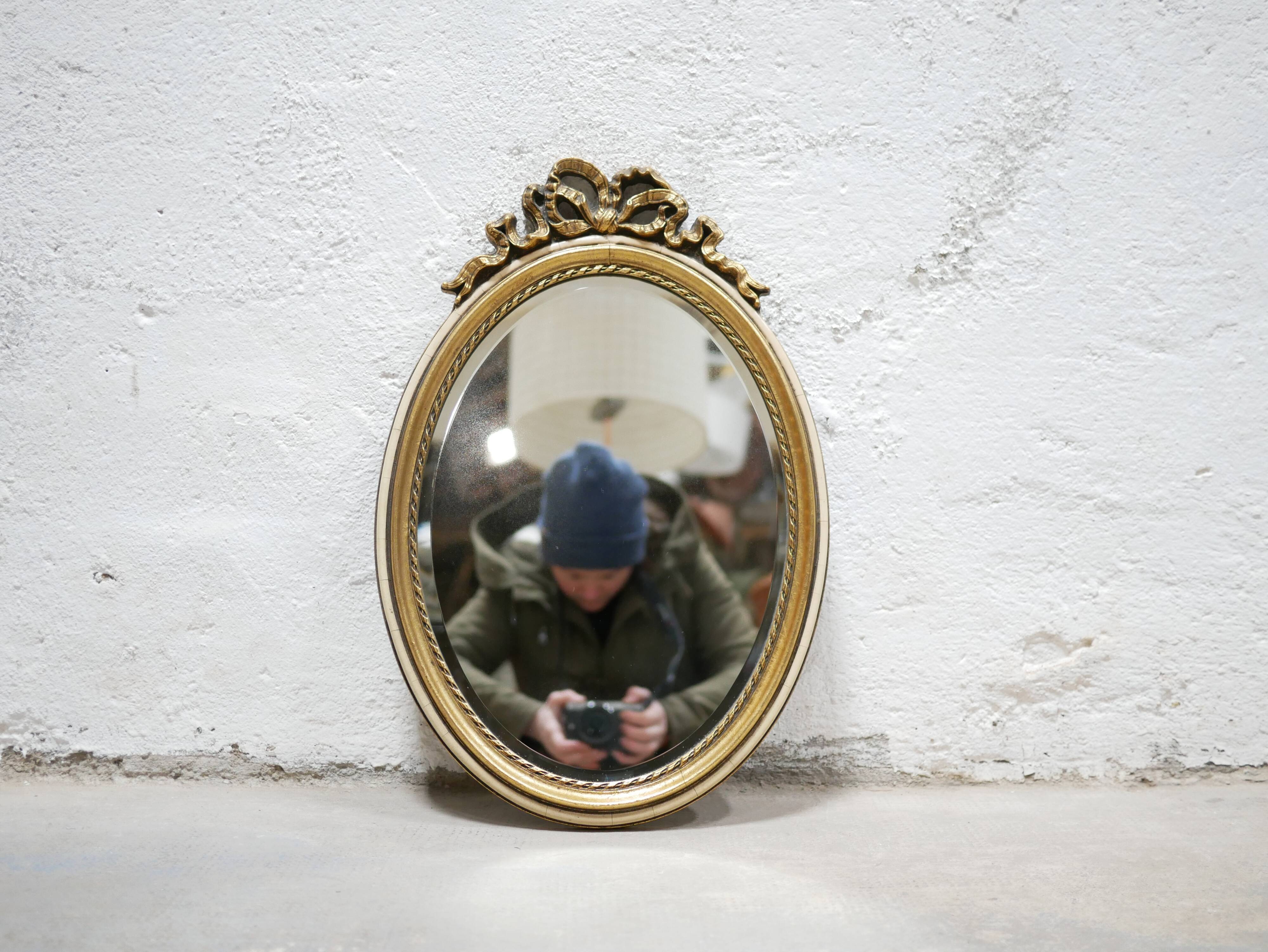 Old oval mirror Louis XVI style in gilded wood 50cm x 34cm