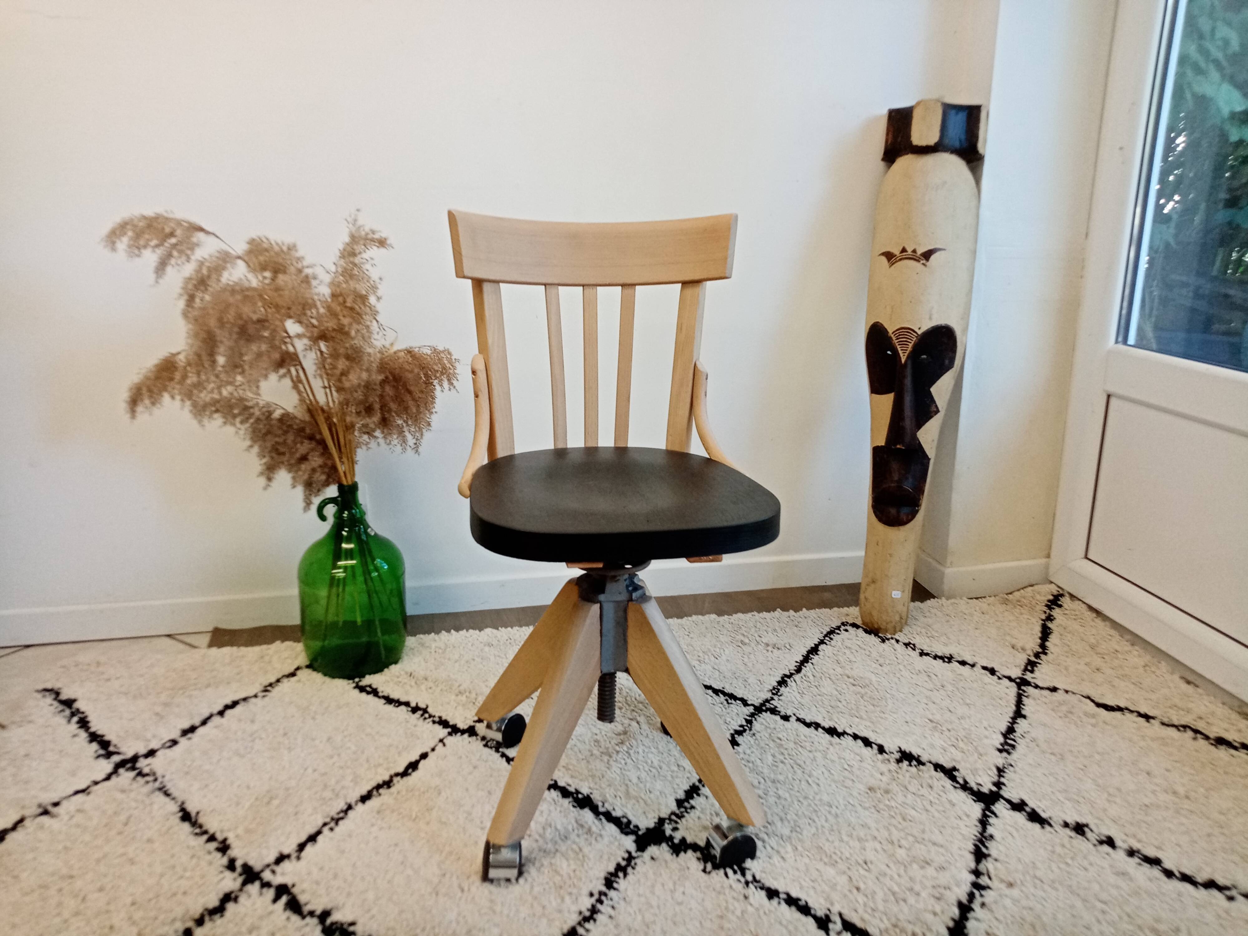 Black and wood workshop chair with metal base