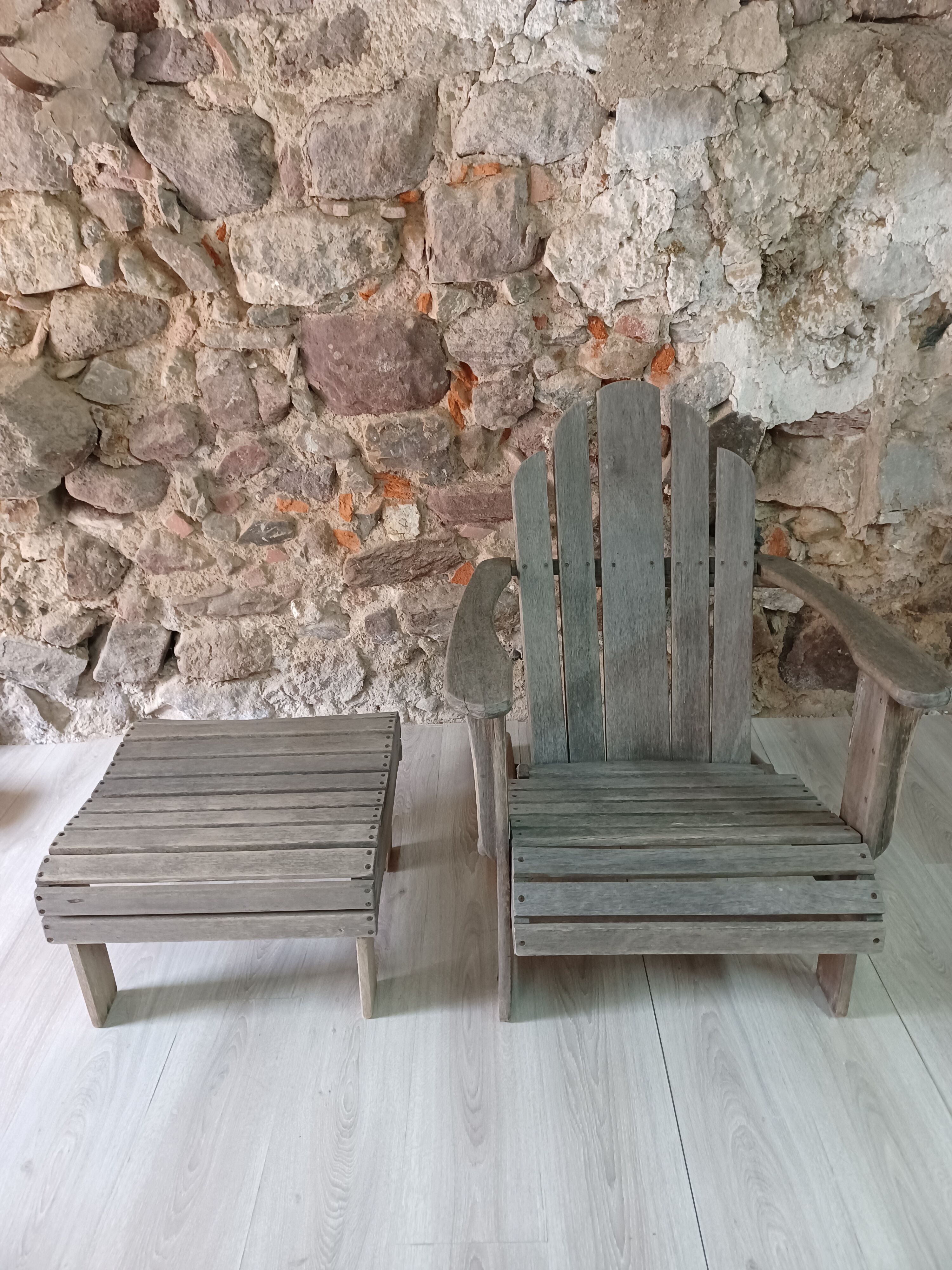 Ancient Adirondack armchair with footrest