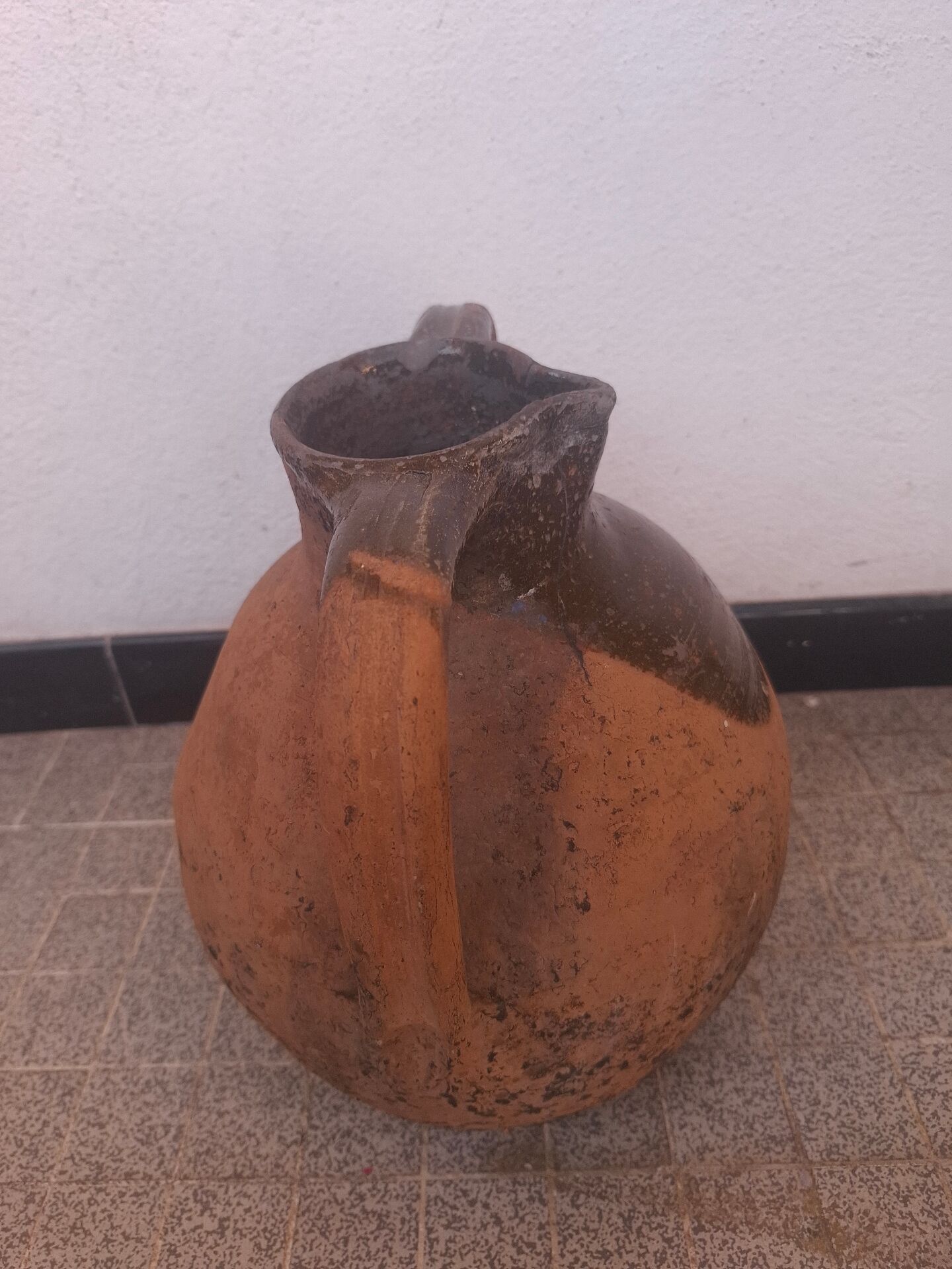 Jug, I stop at glazed terracotta oil.