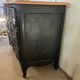 Black and wood chest of drawers