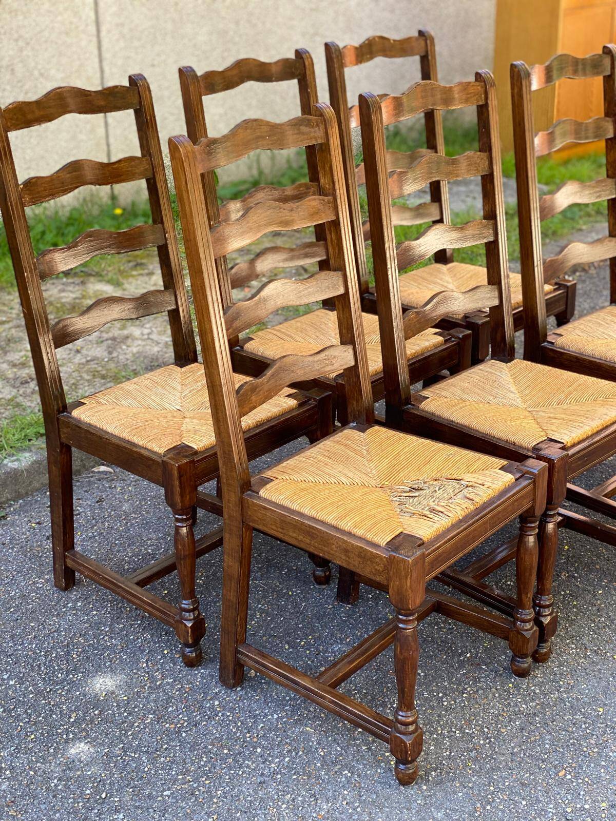 6 solid wood chairs in dark oak with a glossy finish and straw.
