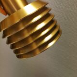 Hanging lamp in gold-colored aluminum with many layers of shades.
