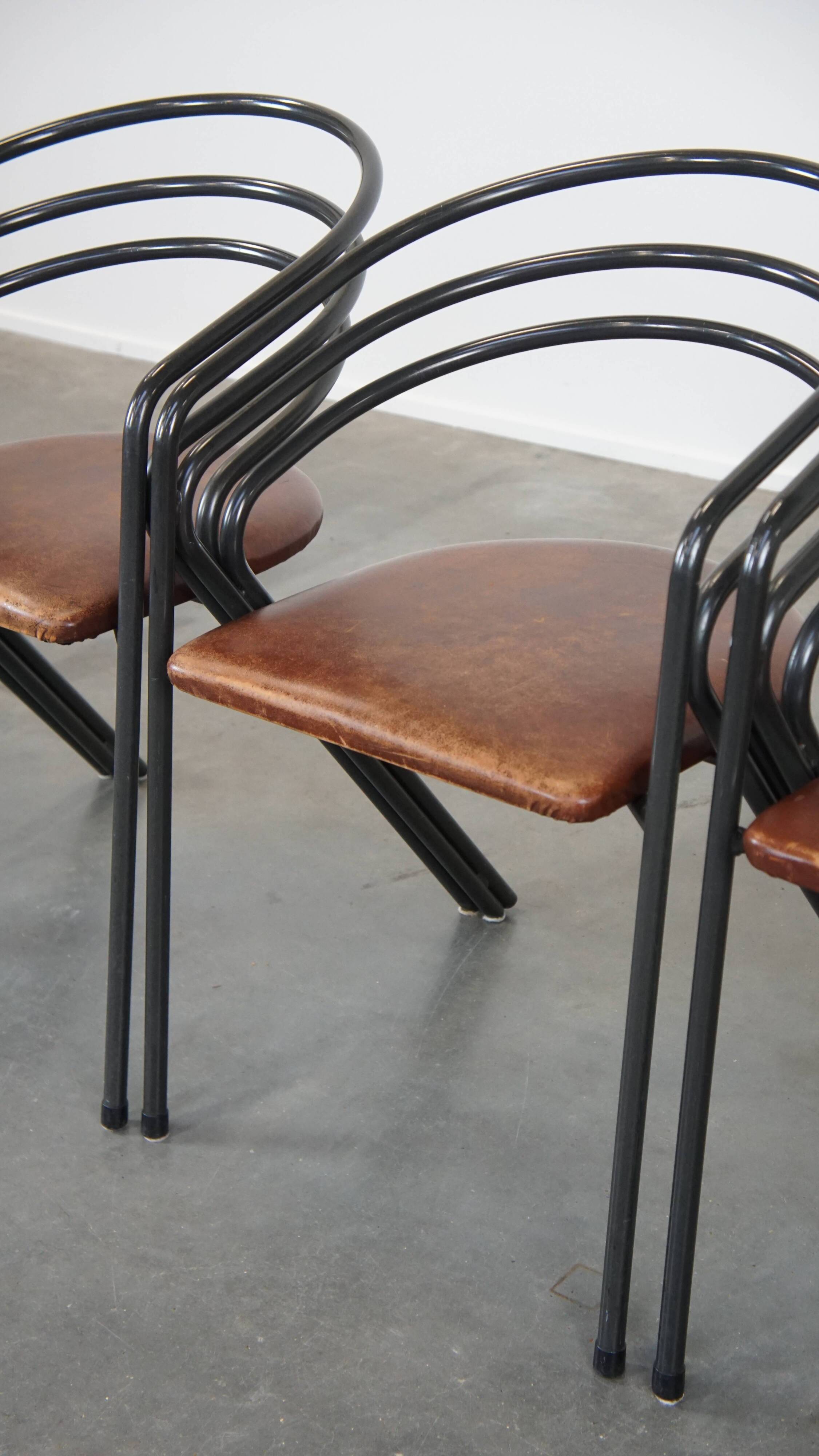Set of 4 1970s design dining chairs with leather seats and metal frame