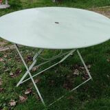 Old round folding metal table