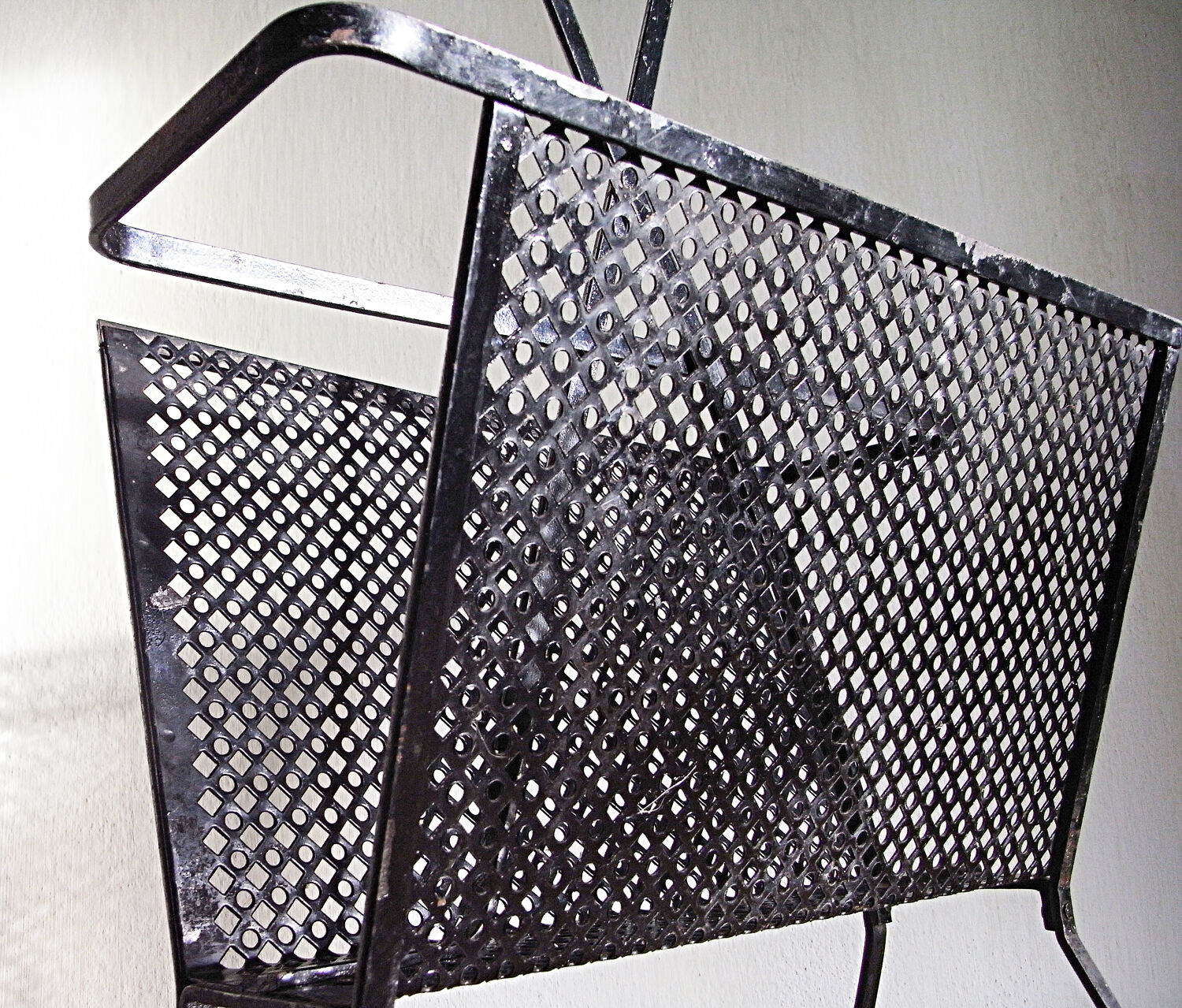 Black magazine door Mathieu Mategot in perforated metal 50s