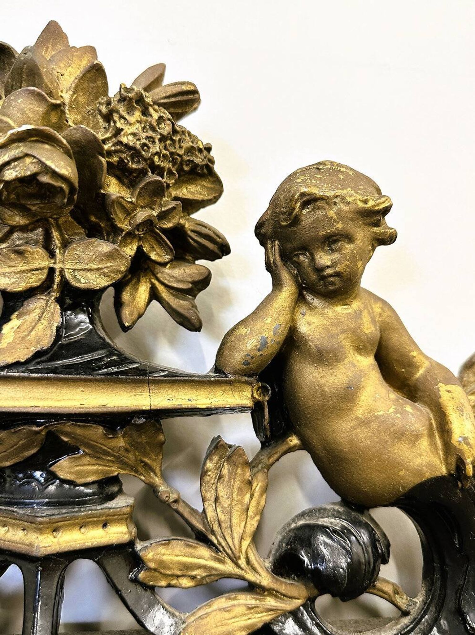 Antique 1800s black and gold mirror with cupid, France 1800s.