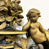 Antique 1800s black and gold mirror with cupid, France 1800s.