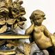 Antique 1800s black and gold mirror with cupid, France 1800s.