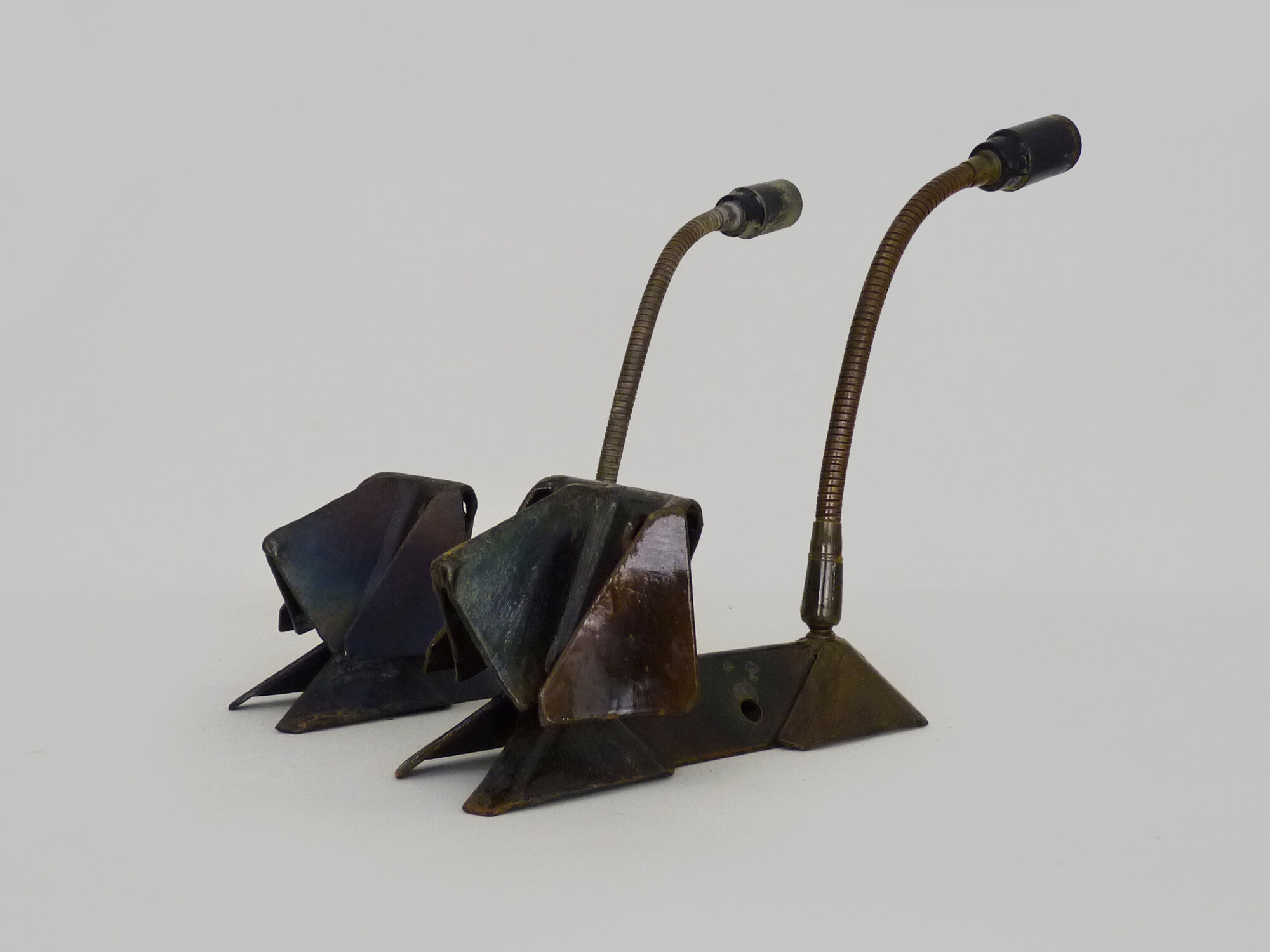 Pair of cast iron wall sconces with articulated arm, dog shape. Vintage
