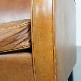 Characteristic sheepskin design armchair in beautiful warm cognac colours