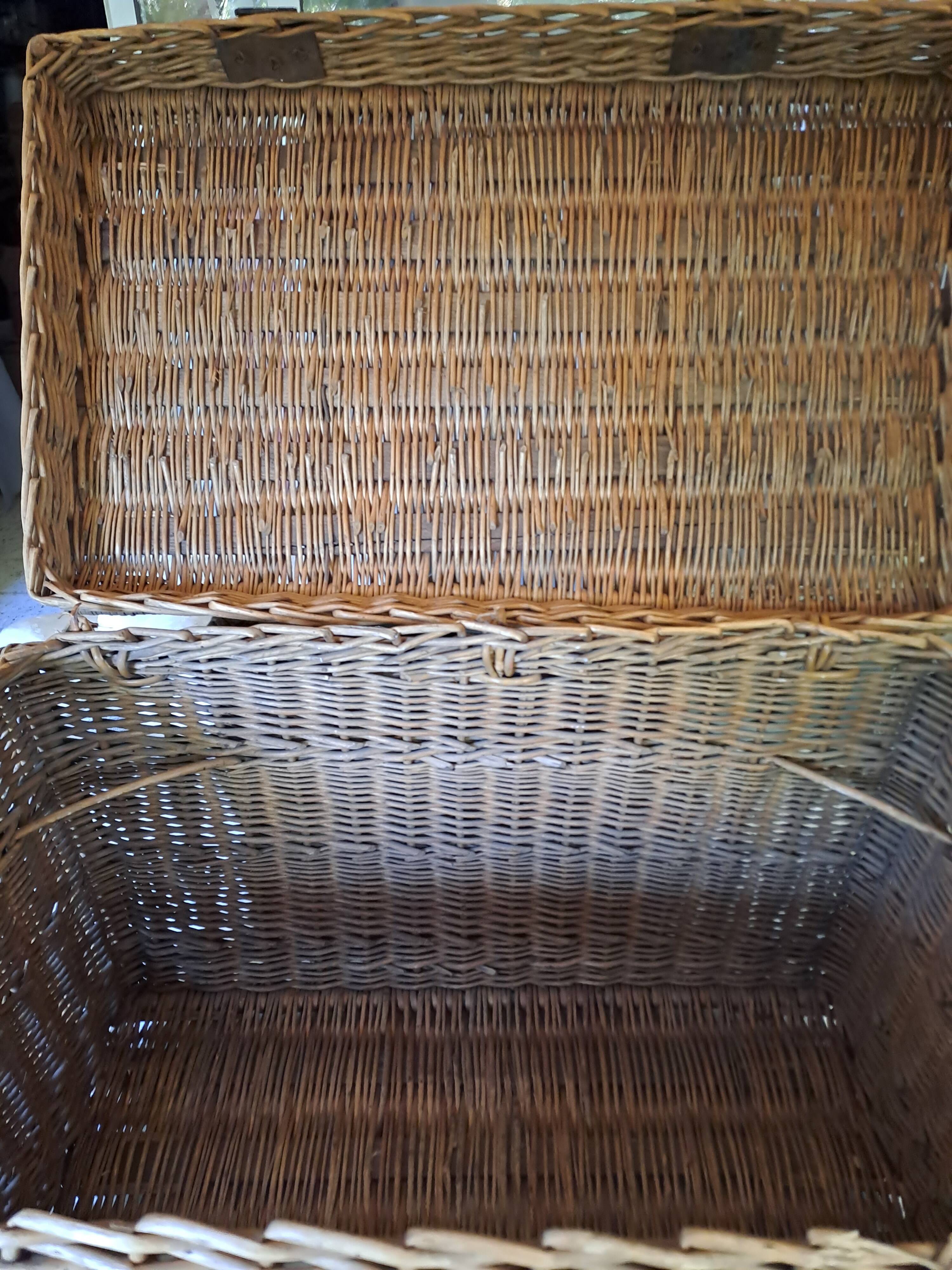 Wicker travel trunk XIX with metal clasps and handles.