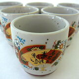 Far Eastern porcelain sake service consisting of a carafon and six cups