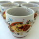 Far Eastern porcelain sake service consisting of a carafon and six cups
