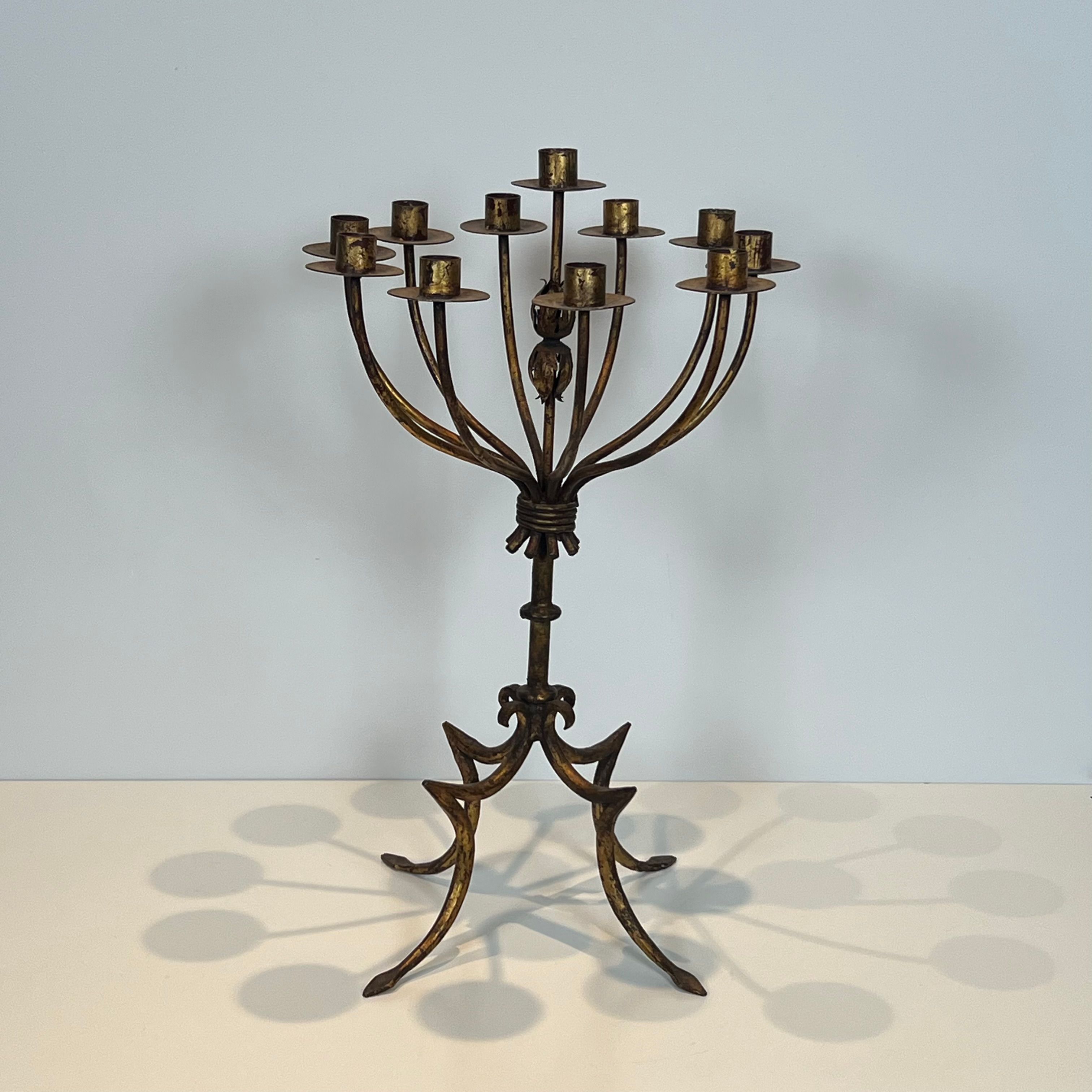 Important gilded wrought iron candelabrum with 11 arms.