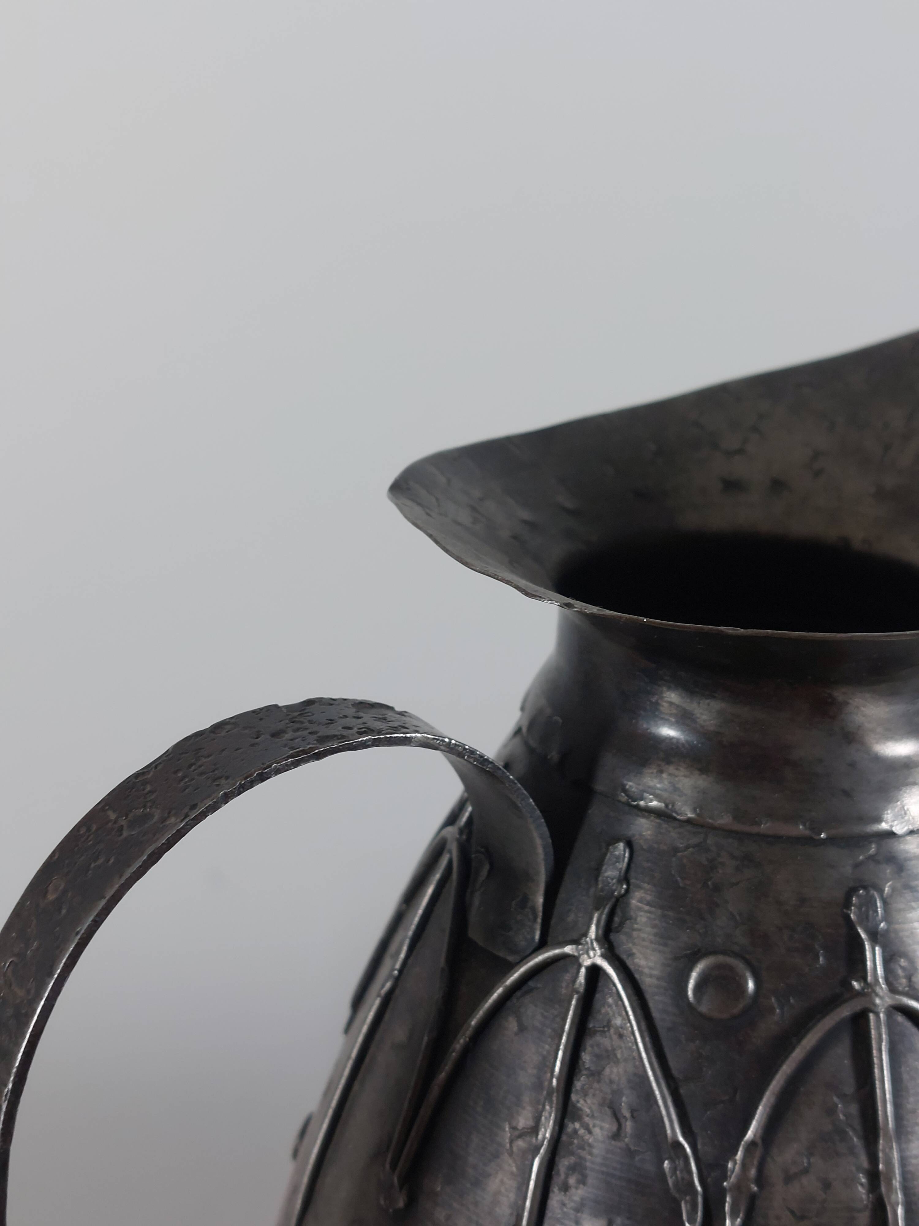 Rare hand-forged metal pitcher and craftsmanship from France.