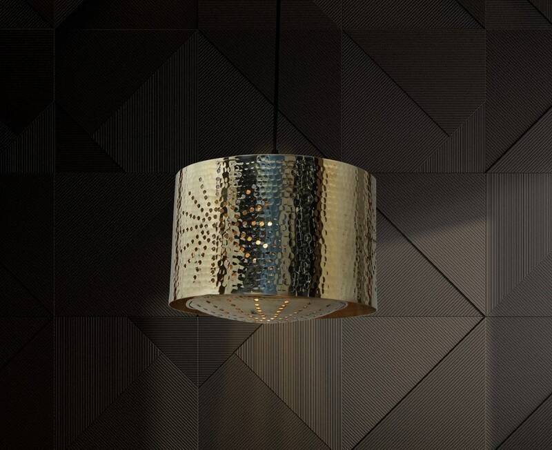 Hammered copper metal pendant light with a golden cylindrical shade.