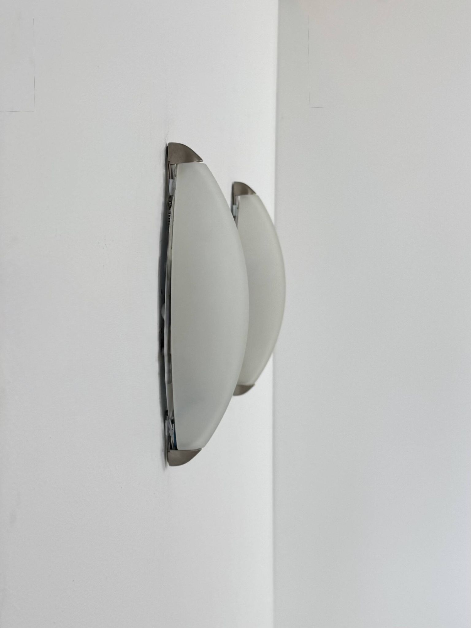 Vintage wall lights, chrome metal and frosted glass, France, 1970.