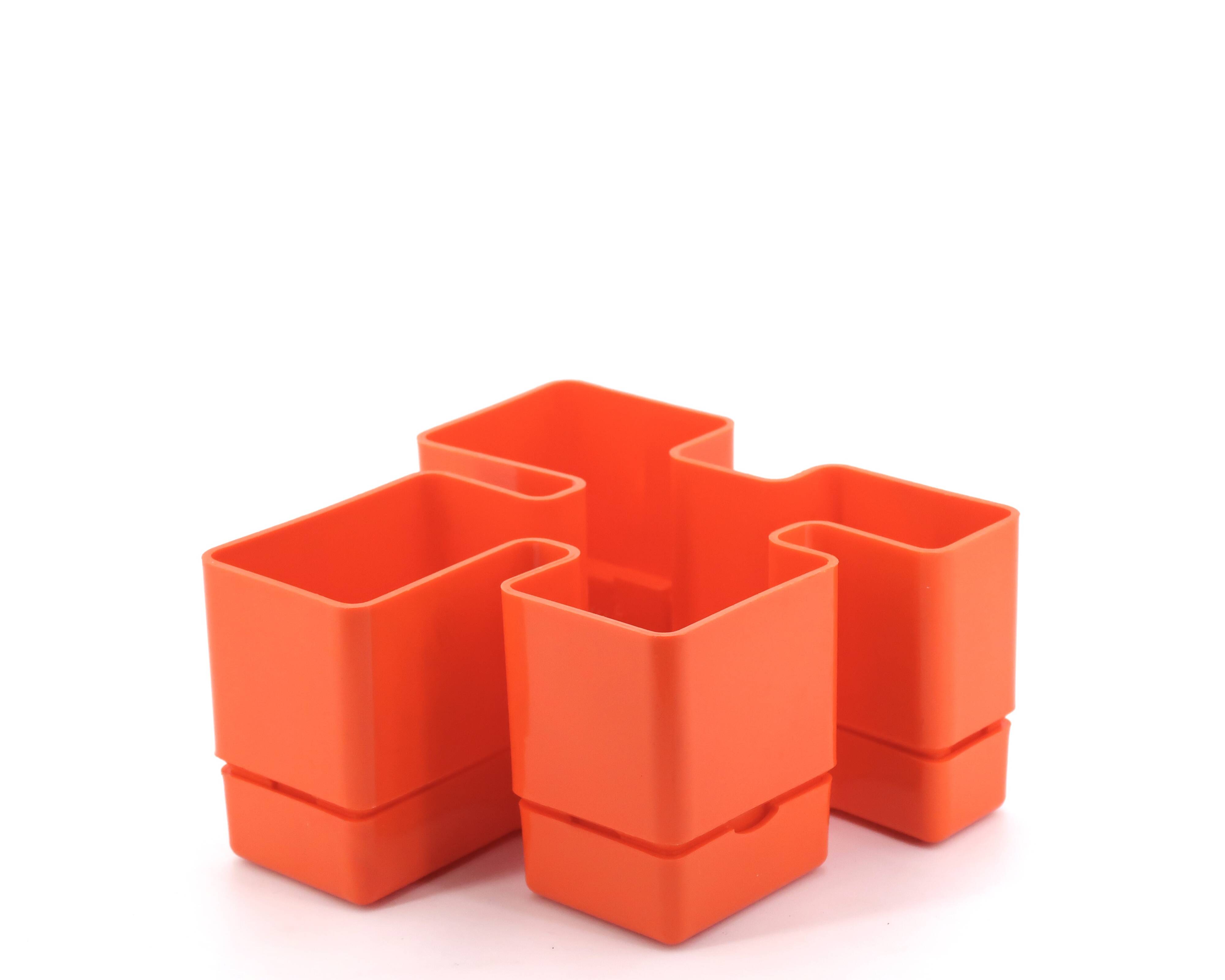 Vastill orange plastic planter by Michael McCann