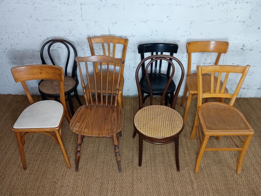 Set of 8 mismatched vintage Baumann Lebrun bistro chairs.