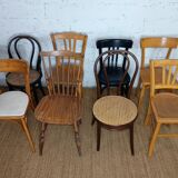 Set of 8 mismatched vintage Baumann Lebrun bistro chairs.