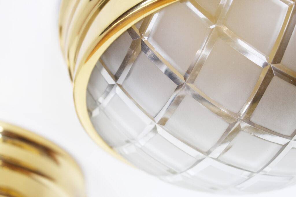 Pair of vintage brass ceiling lights with glass globe