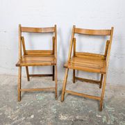 Pair of wooden folding chairs