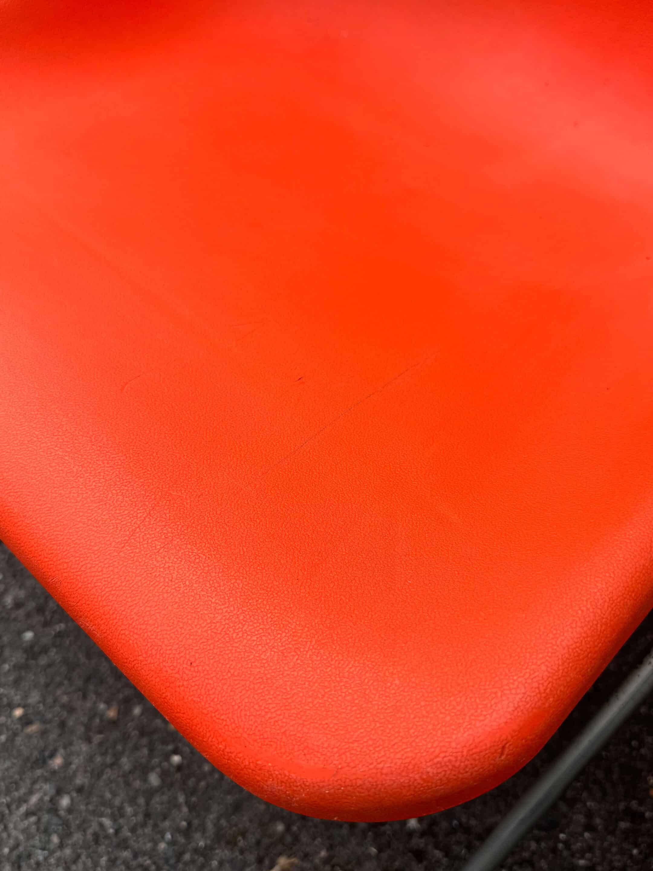 Set of 4 orange chairs designed by Robin Day for Hille.