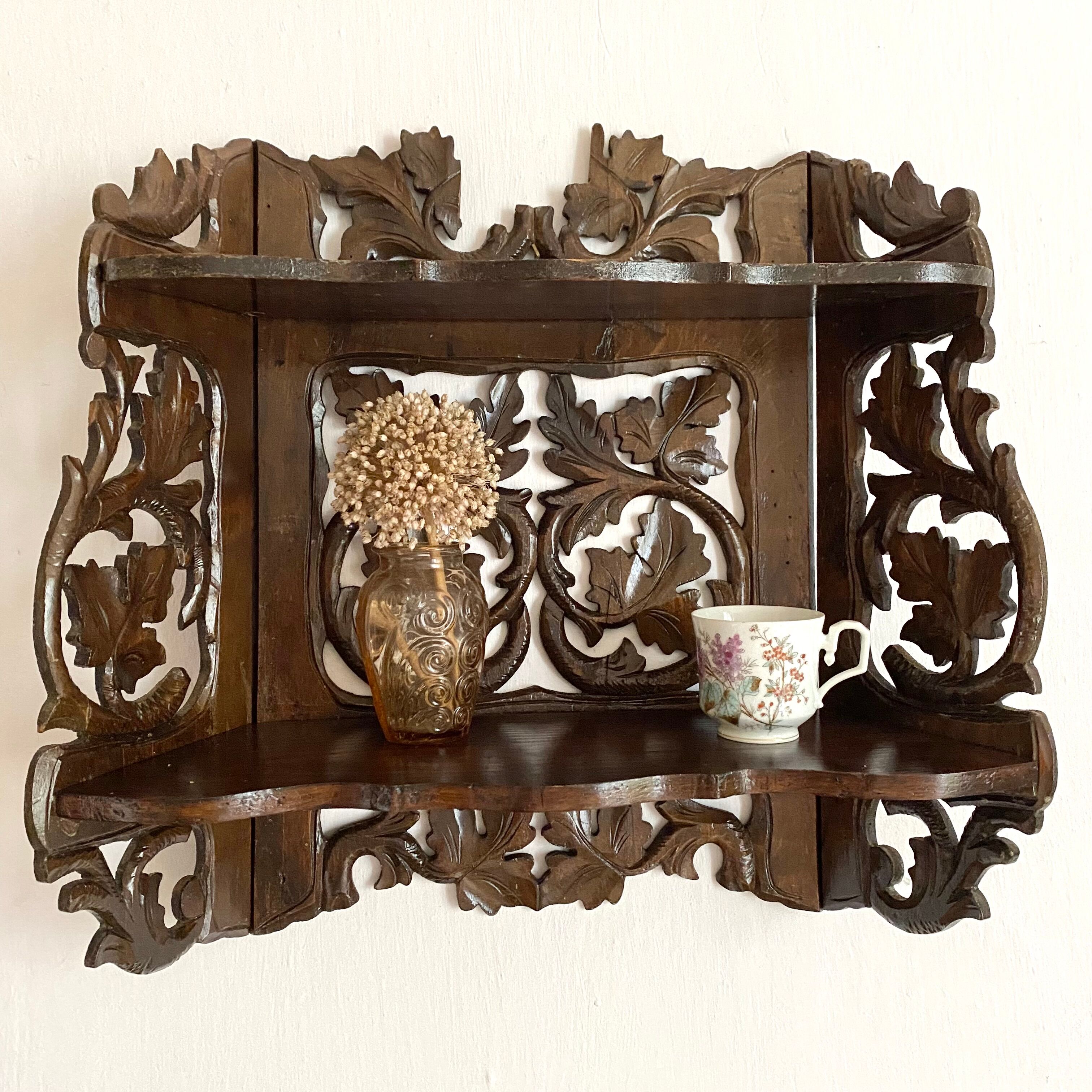 Carved wooden wall shelf