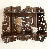 Carved wooden wall shelf