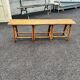 Vintage 1950s set: large table with tripod base and benches in woven chestnut