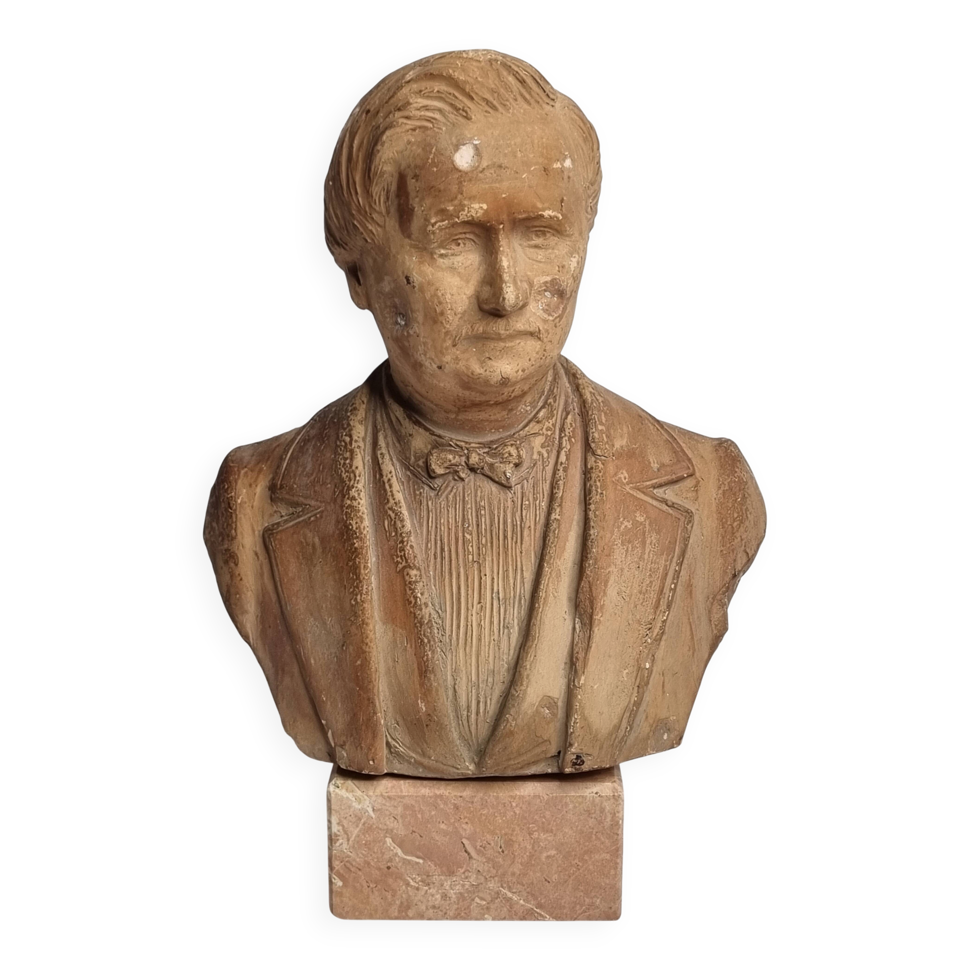 Bust of a notable in terracotta, 29 cm, signed Pasquet, 1870, on a base.