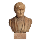 Bust of a notable in terracotta, 29 cm, signed Pasquet, 1870, on a base.